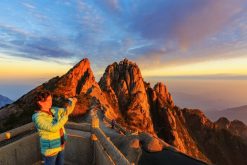 Lion Peak at sunrise on a Mount Huangshan tour with golden light
